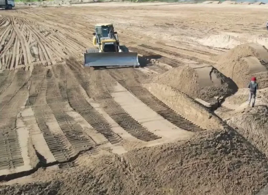 Bulldozer working on soil.