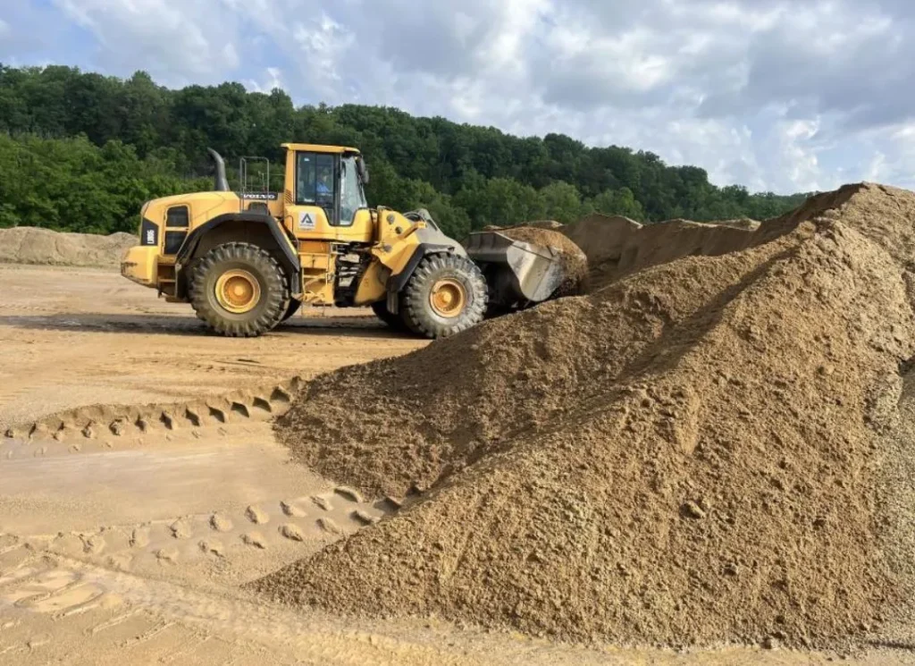 Wheel loader moving sand.