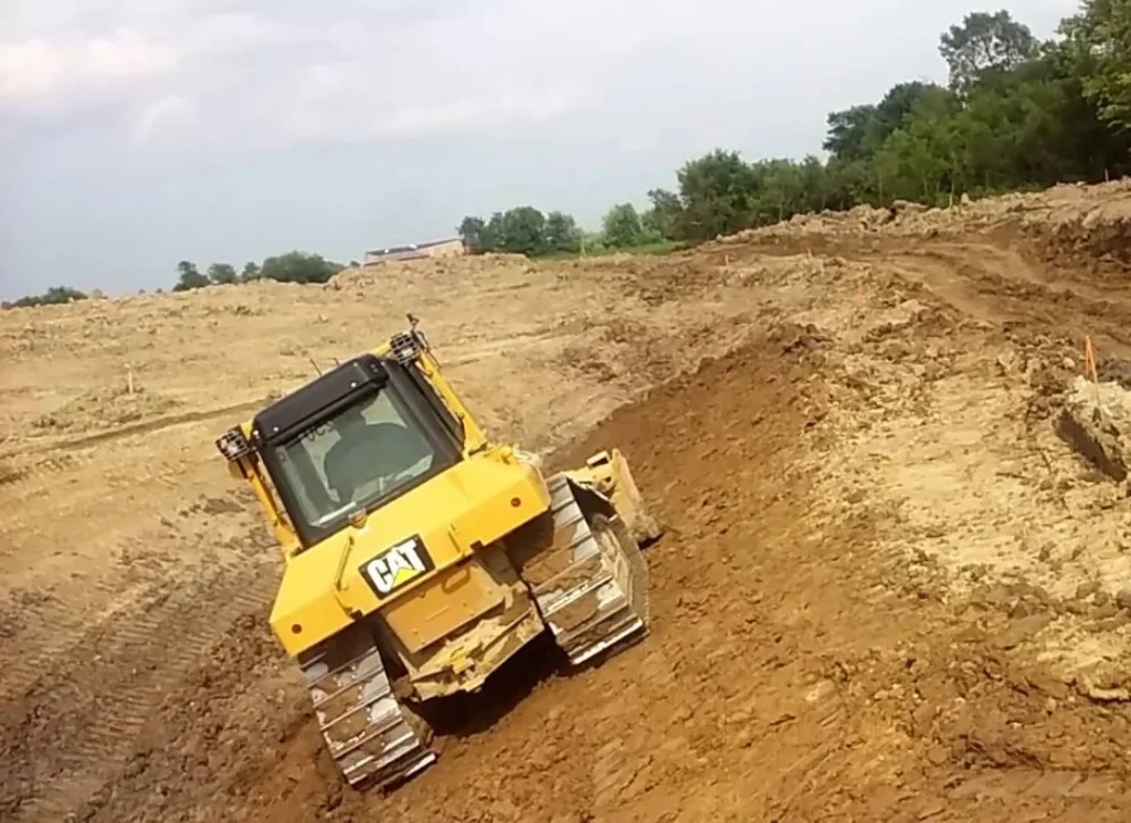 Bulldozer grading soil