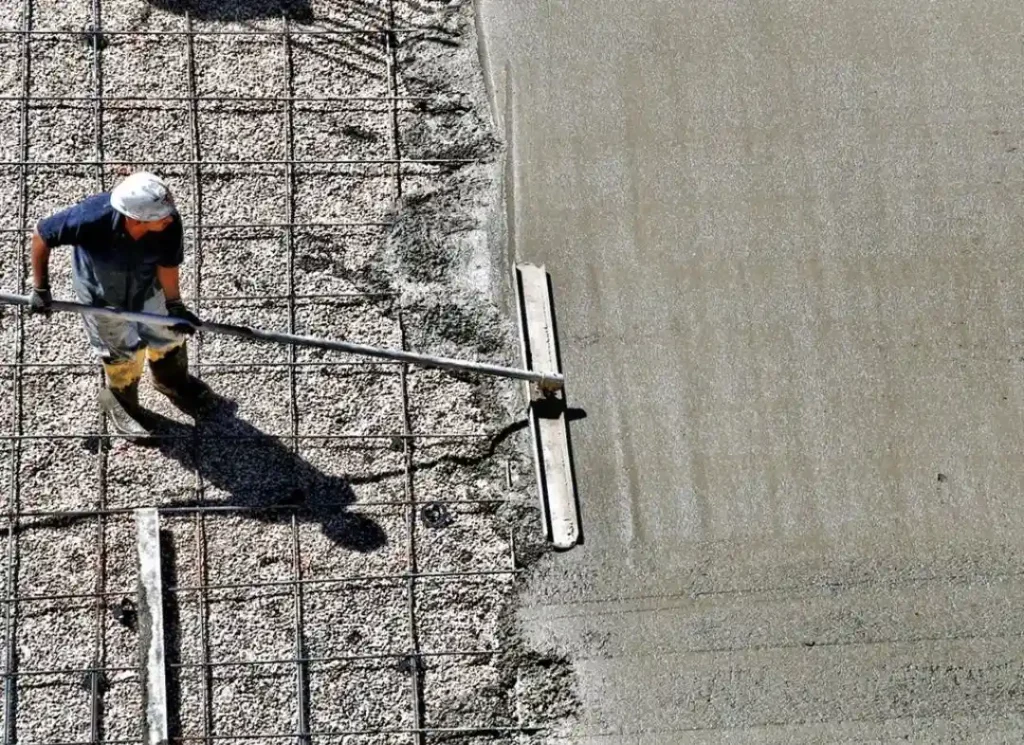 Man smoothing concrete slab
