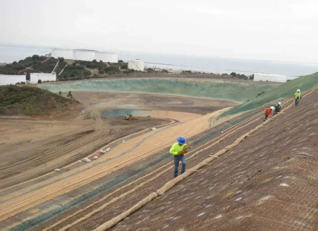 Workers installing erosion control